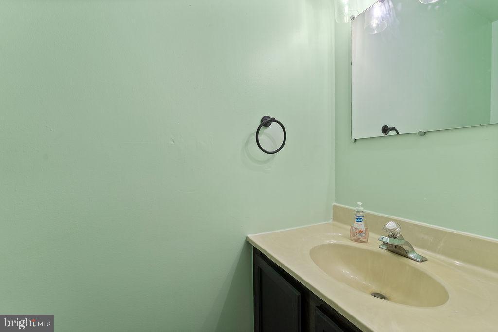 127 Saylers Creek Road Locust Grove, VA 22508 - Photo 28 of 56 a bathroom with a sink and a mirror