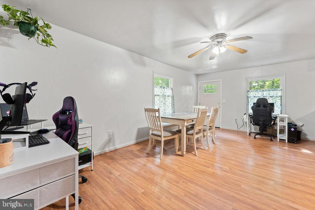 127 Saylers Creek Road Locust Grove, VA 22508 - Photo 29 of 56 a view of a dining room with furniture and wooden floor