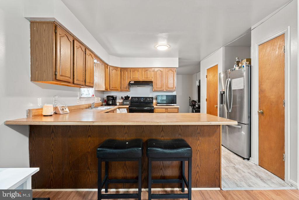 127 Saylers Creek Road Locust Grove, VA 22508 - Photo 34 of 56 a kitchen with a sink cabinets and window