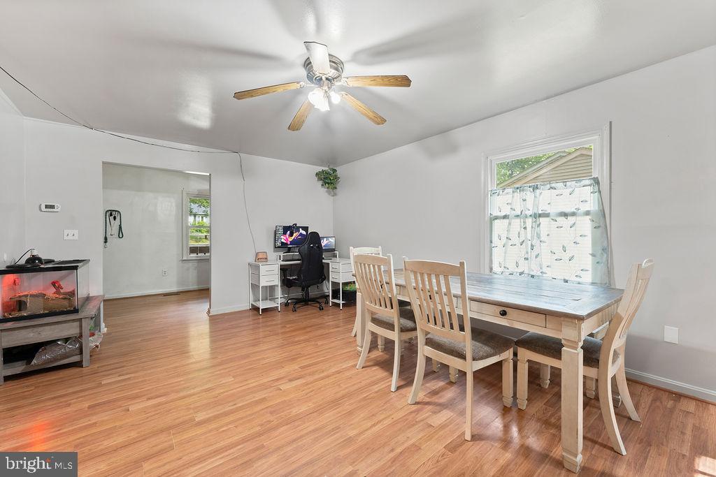 127 Saylers Creek Road Locust Grove, VA 22508 - Photo 35 of 56 a view of a dining room with furniture window and wooden floor