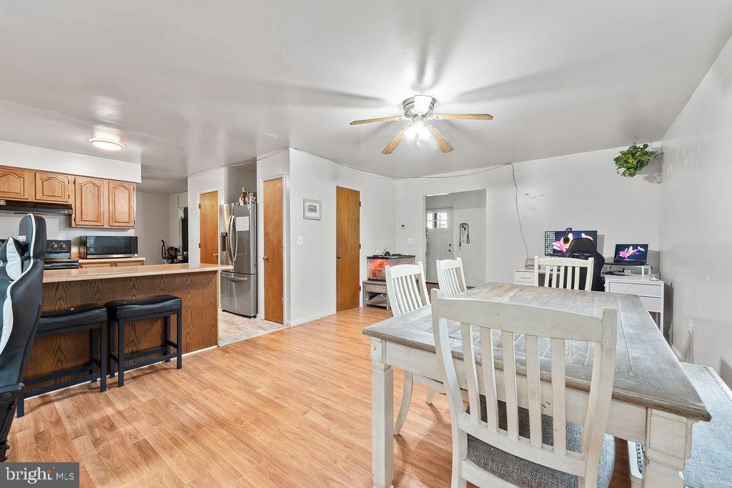 127 Saylers Creek Road Locust Grove, VA 22508 - Photo 36 of 56 a bedroom with furniture and a chandelier