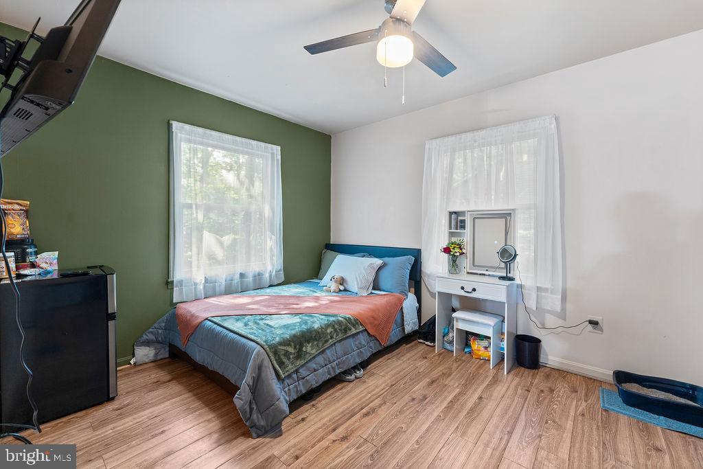 127 Saylers Creek Road Locust Grove, VA 22508 - Photo 39 of 56 a bedroom with a bed and a chandelier