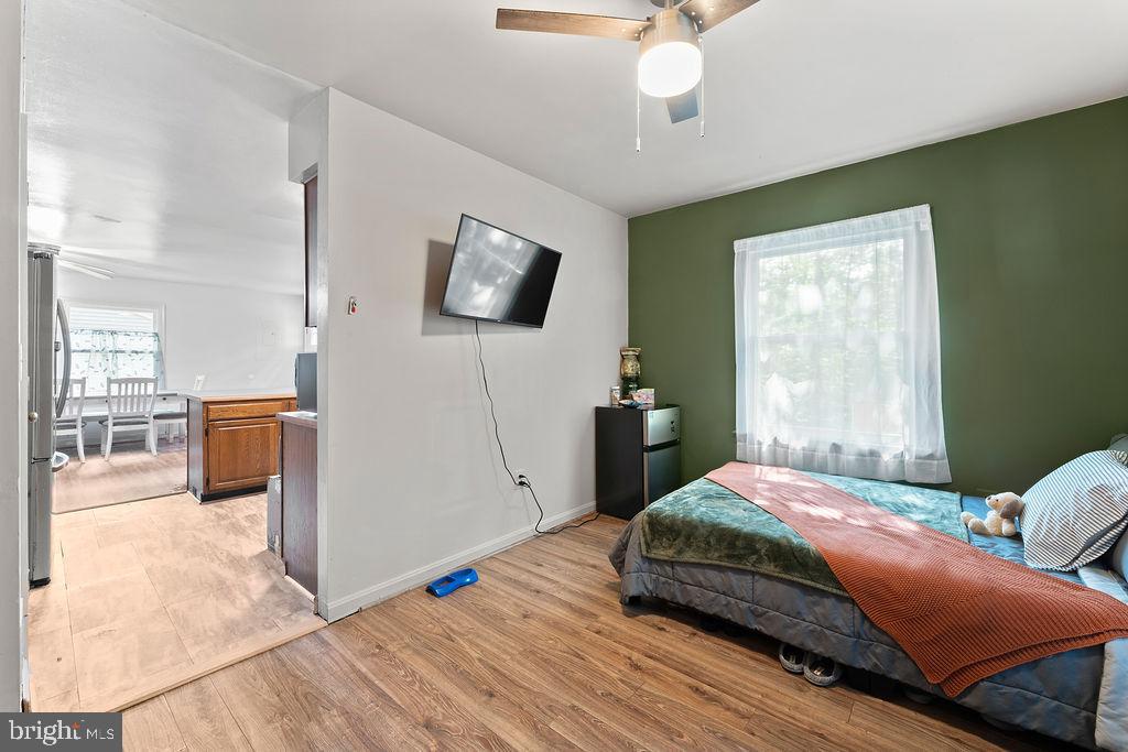 127 Saylers Creek Road Locust Grove, VA 22508 - Photo 40 of 56 a bedroom with a bed a mirror on dresser and a window