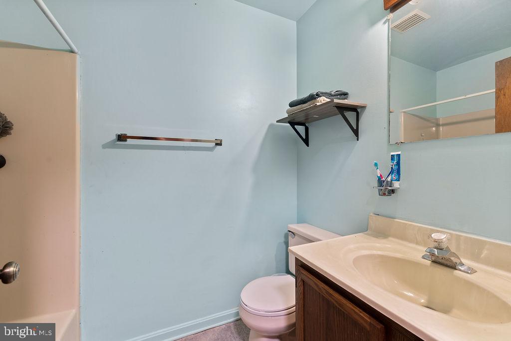 127 Saylers Creek Road Locust Grove, VA 22508 - Photo 47 of 56 a bathroom with a sink toilet and vanity