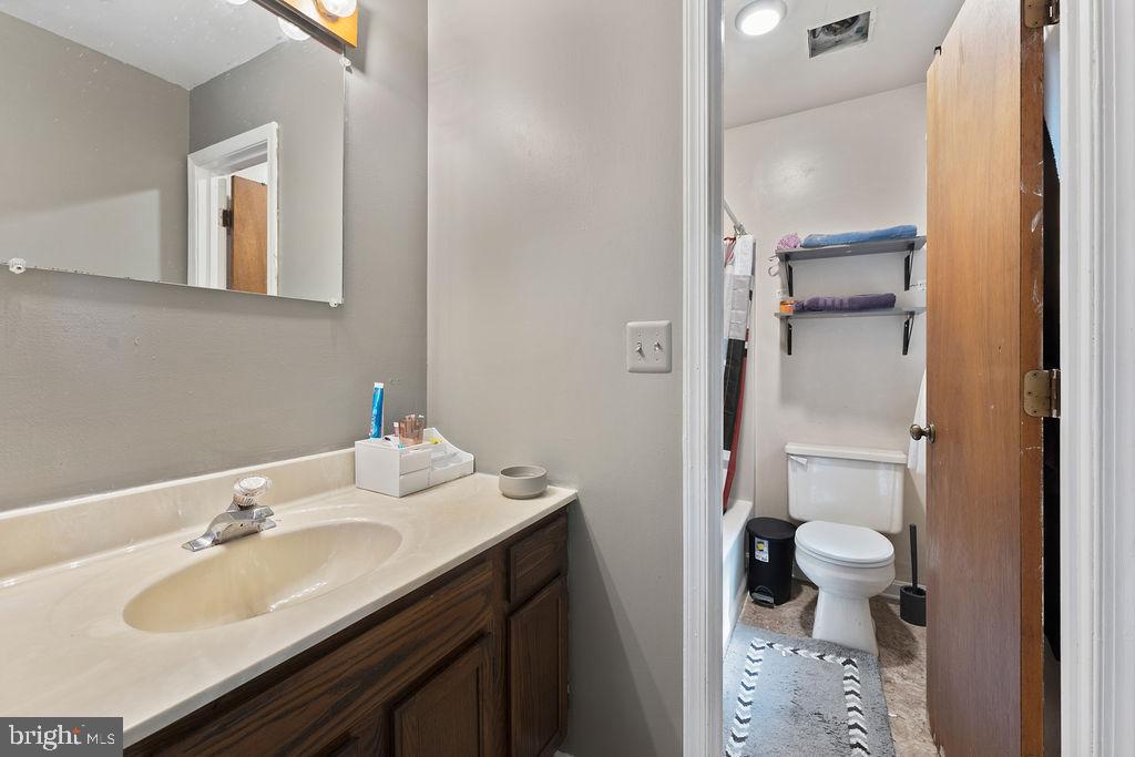 127 Saylers Creek Road Locust Grove, VA 22508 - Photo 51 of 56 a bathroom with a sink and a mirror