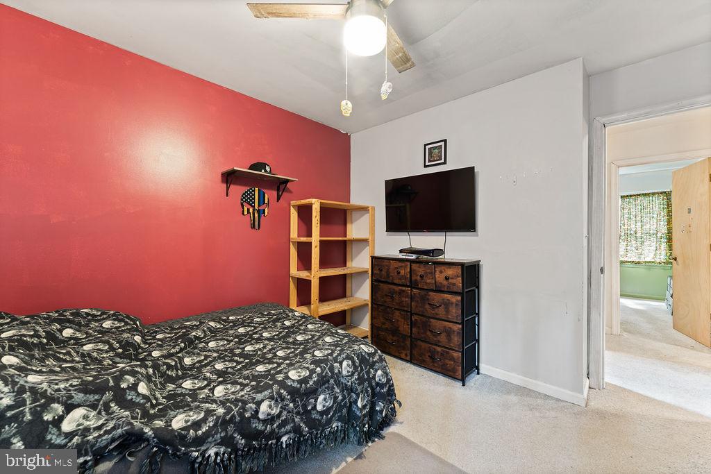 127 Saylers Creek Road Locust Grove, VA 22508 - Photo 54 of 56 a bedroom with a bed and a flat screen tv