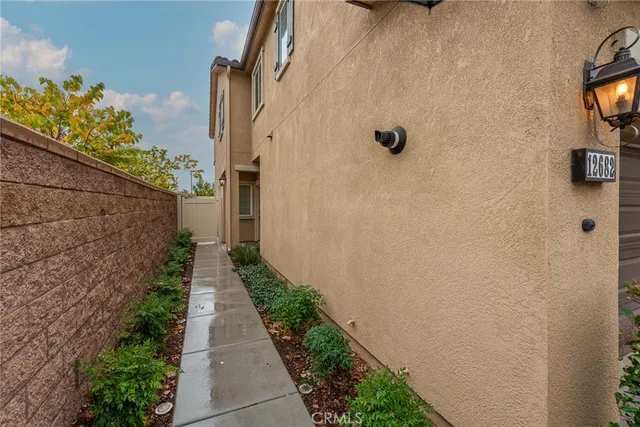 a view of a pathway both side of a house