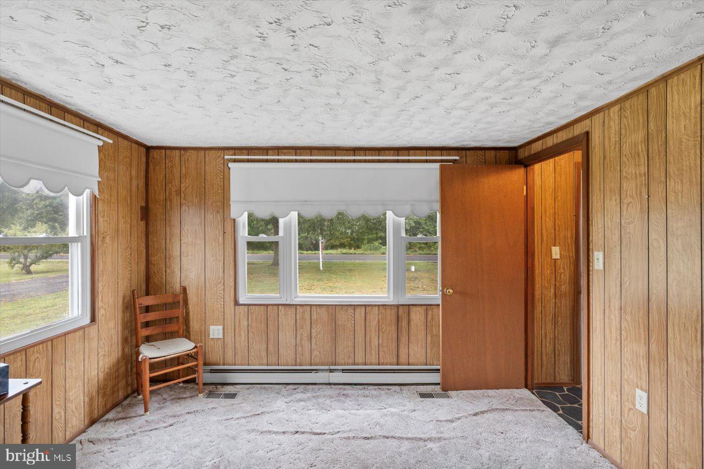 110 Longfield Road Colonial Beach, VA 22443 - Photo 14 of 40 a view of a room with a large window and front door