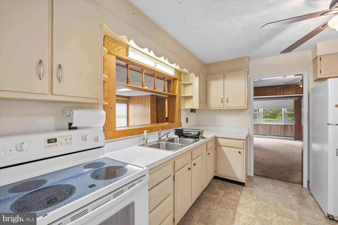 110 Longfield Road Colonial Beach, VA 22443 - Photo 16 of 40 a kitchen that has a sink and a stove in it