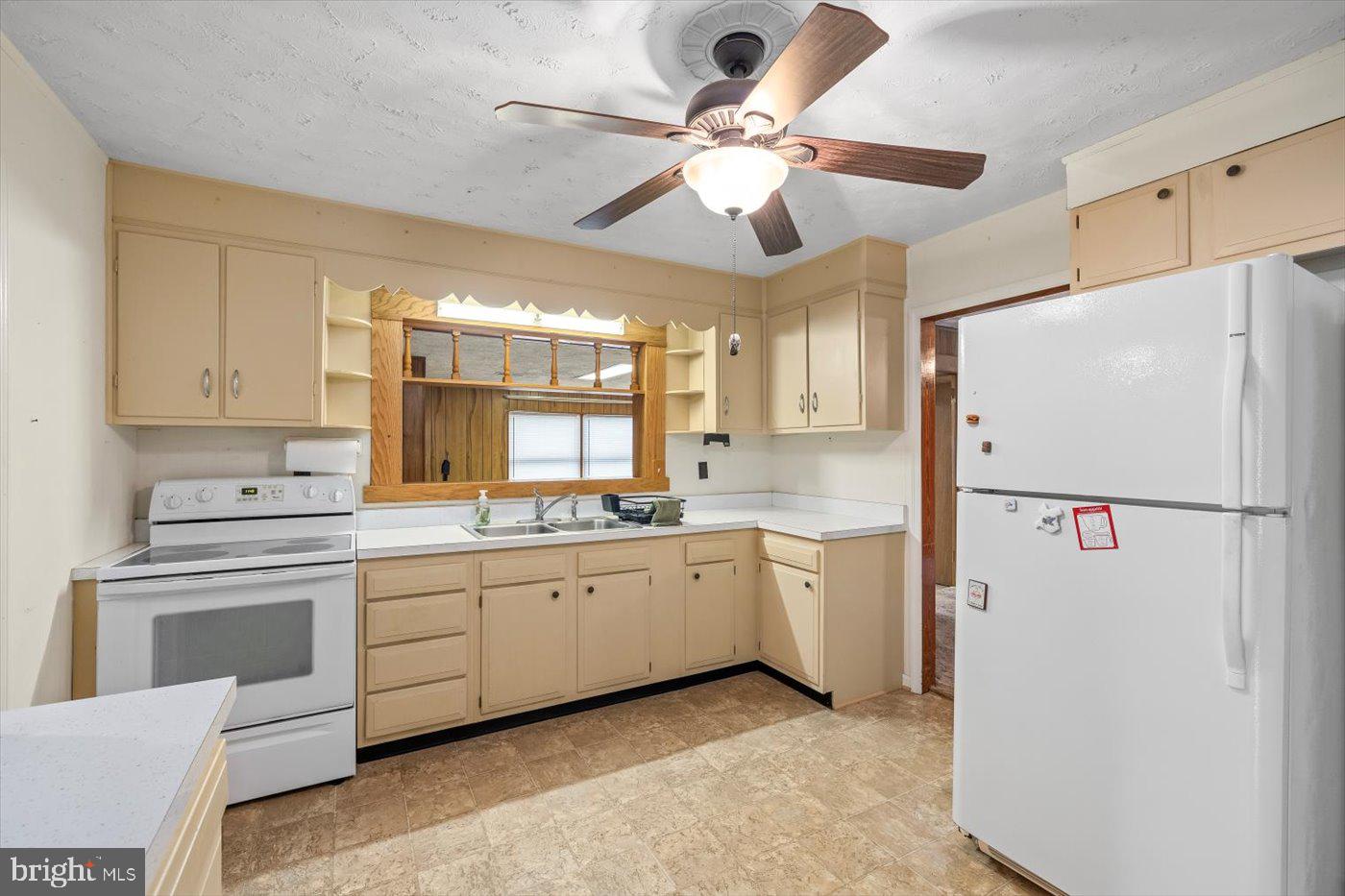 110 Longfield Road Colonial Beach, VA 22443 - Photo 17 of 40 a kitchen with appliances a sink and cabinets
