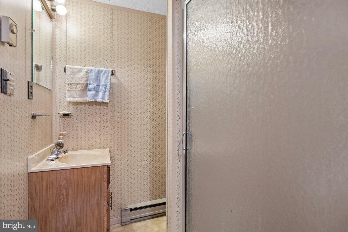 110 Longfield Road Colonial Beach, VA 22443 - Photo 26 of 40 a bathroom with a sink and mirror