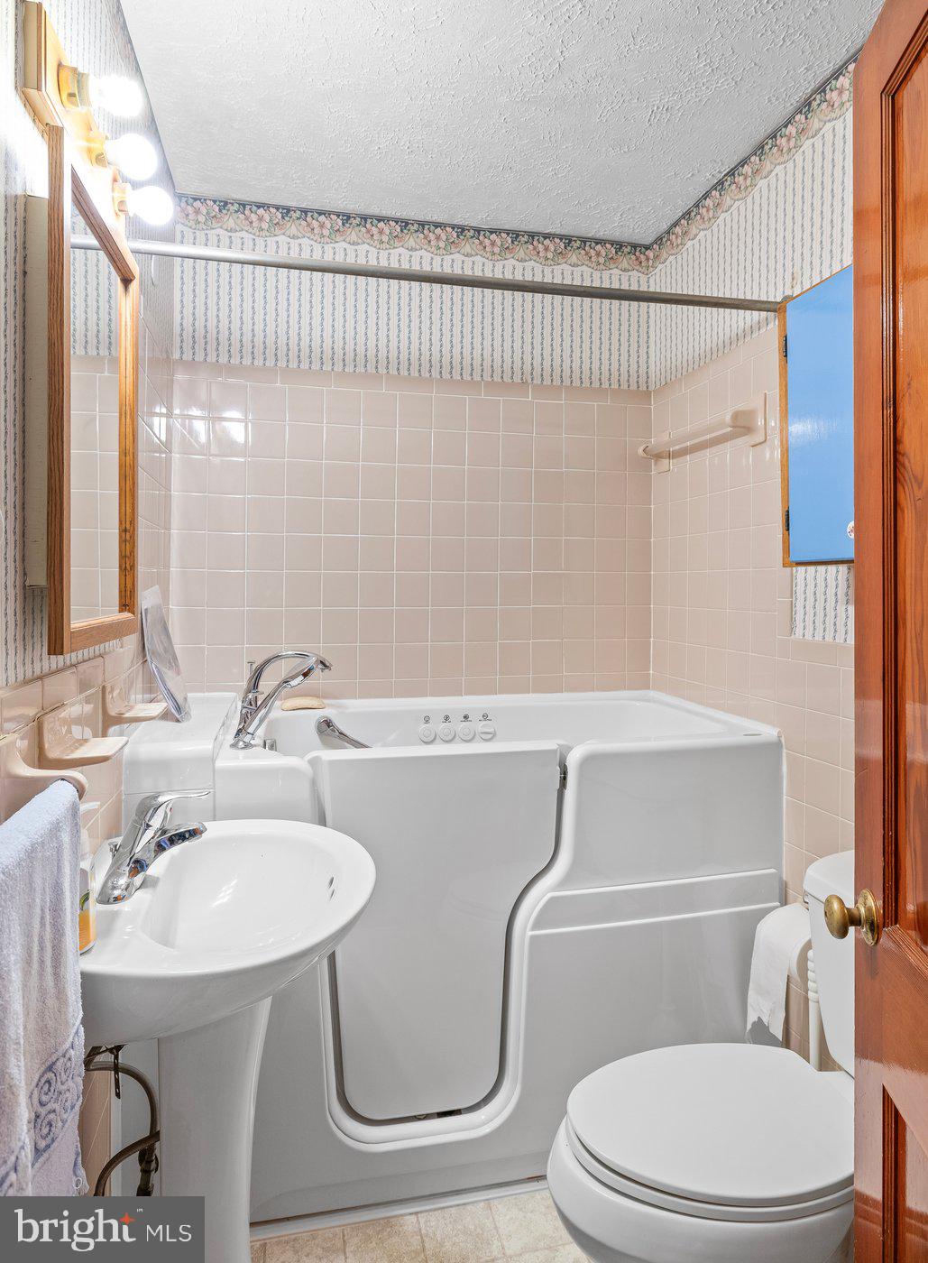 110 Longfield Road Colonial Beach, VA 22443 - Photo 27 of 40 a bathroom with a sink a mirror and a toilet