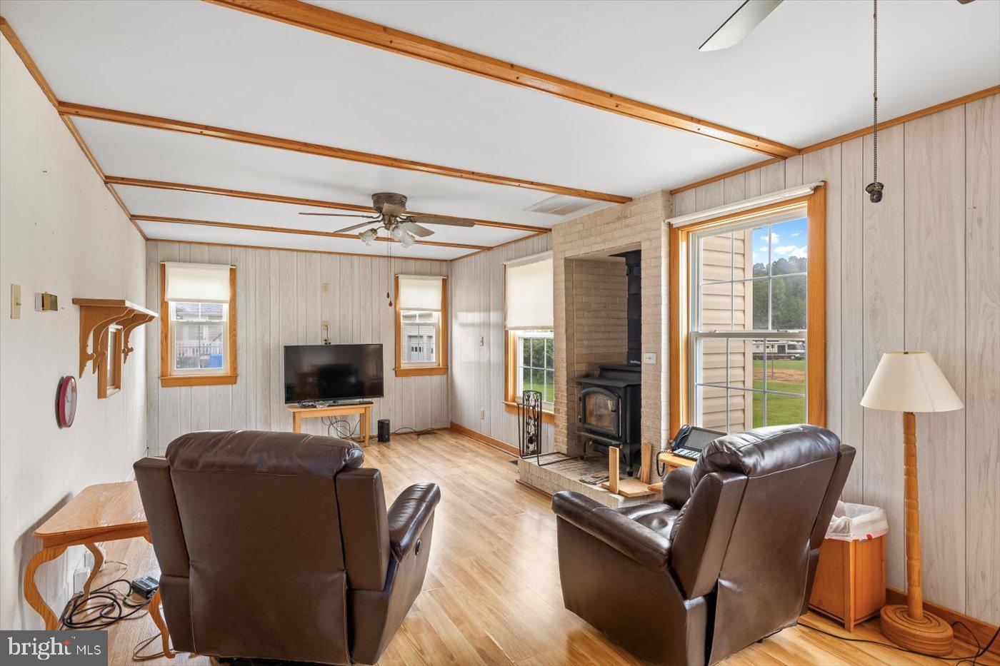 110 Longfield Road Colonial Beach, VA 22443 - Photo 28 of 40 a living room with furniture fireplace and a flat screen tv