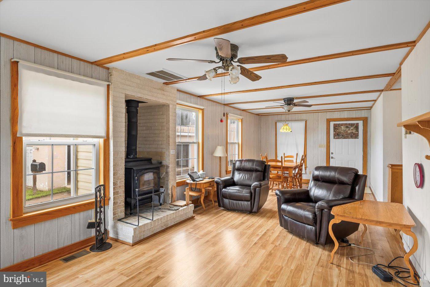 110 Longfield Road Colonial Beach, VA 22443 - Photo 29 of 40 a living room with furniture and a fireplace