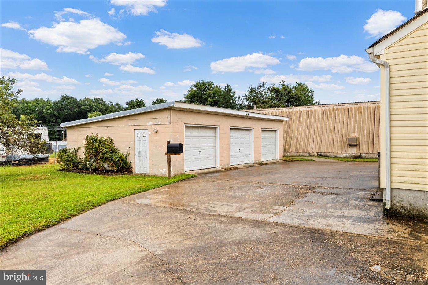 110 Longfield Road Colonial Beach, VA 22443 - Photo 3 of 40 a view of a white house with a yard