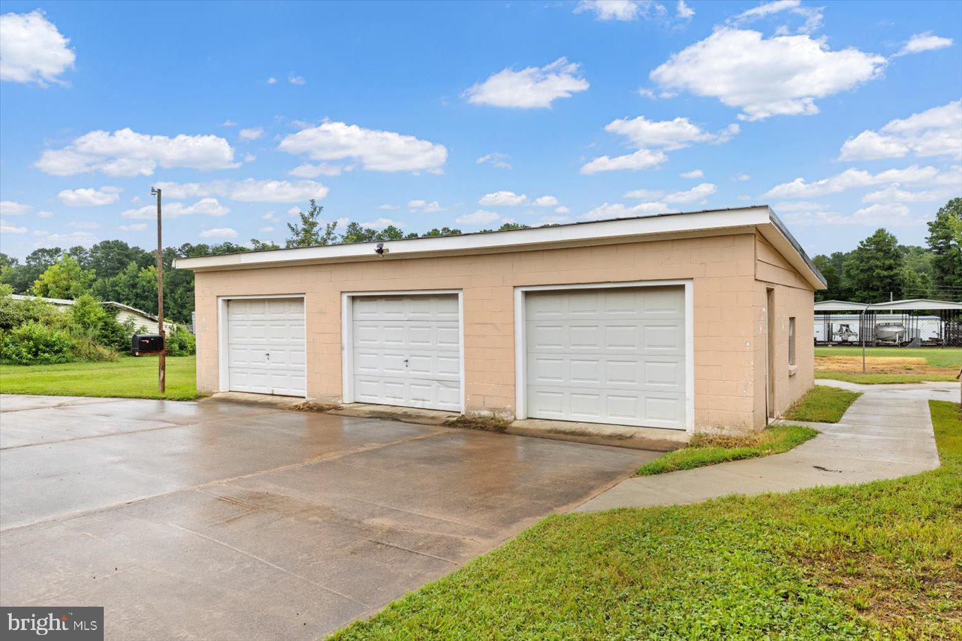 110 Longfield Road Colonial Beach, VA 22443 - Photo 31 of 40 a view of a house with a yard and potted plants