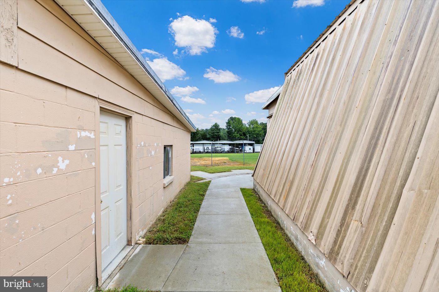 110 Longfield Road Colonial Beach, VA 22443 - Photo 38 of 40 a view of a pathway of a house with a fountain