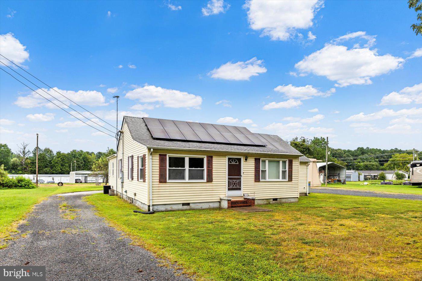 110 Longfield Road Colonial Beach, VA 22443 - Photo 6 of 40 a view of a house with a backyard