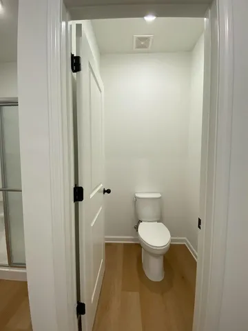 a bathroom with a toilet and a sink