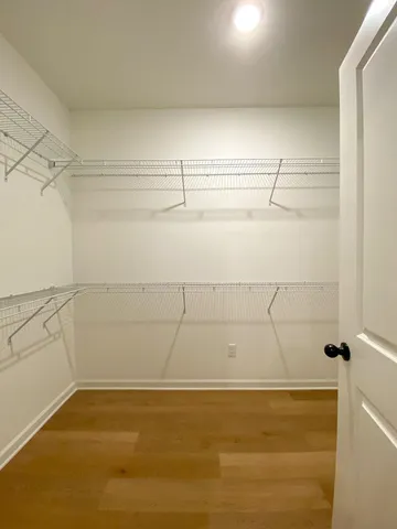 a view of a room with racks on the wall
