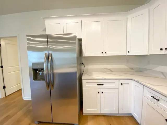 a view of cabinets and wooden floor