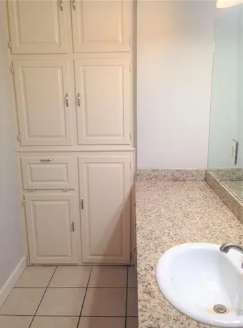 an empty room with wooden floor