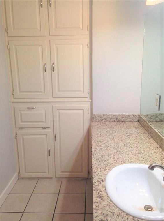 1720 Stonegate Drive Denton, TX 76205 - Photo 12 of 16 an empty room with wooden floor