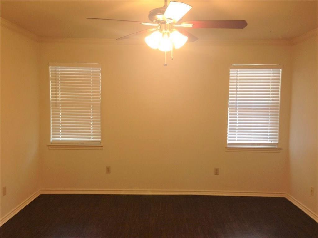 1720 Stonegate Drive Denton, TX 76205 - Photo 14 of 16 a view of an empty room with a window