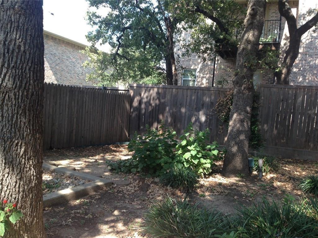 1720 Stonegate Drive Denton, TX 76205 - Photo 15 of 16 a backyard of a house with lots of green space