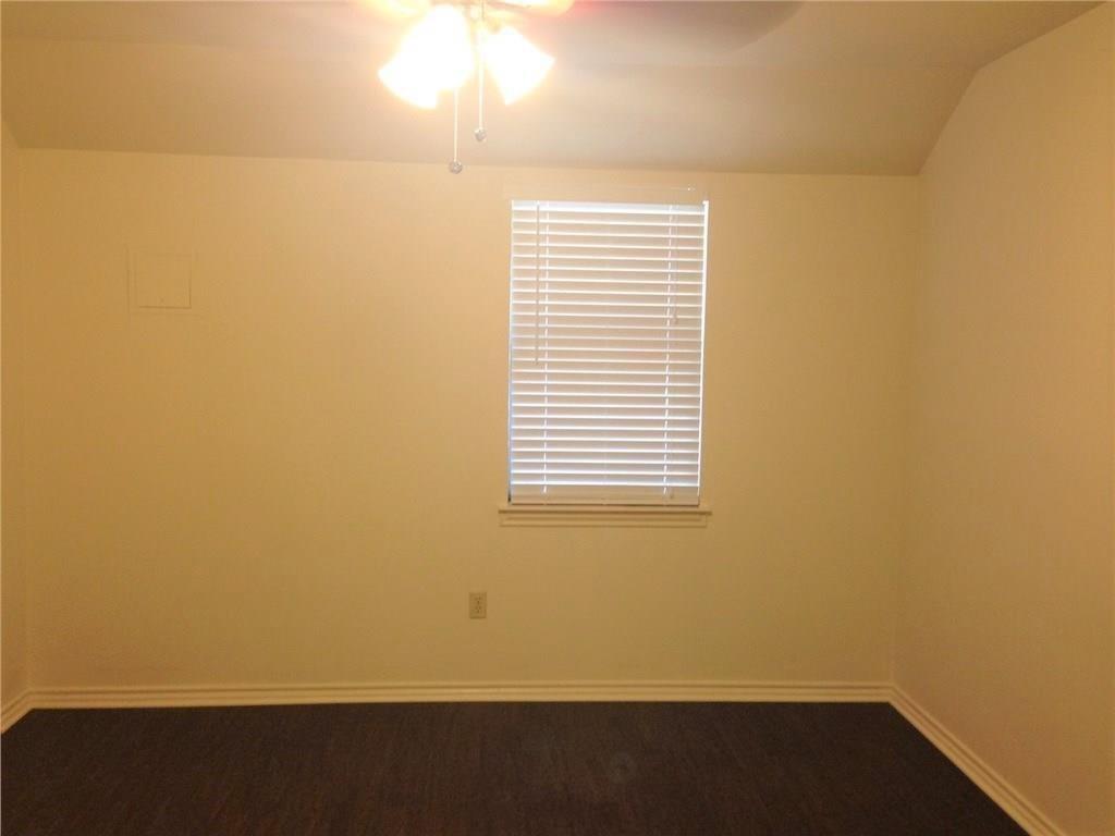 1720 Stonegate Drive Denton, TX 76205 - Photo 10 of 16 an empty room with a window
