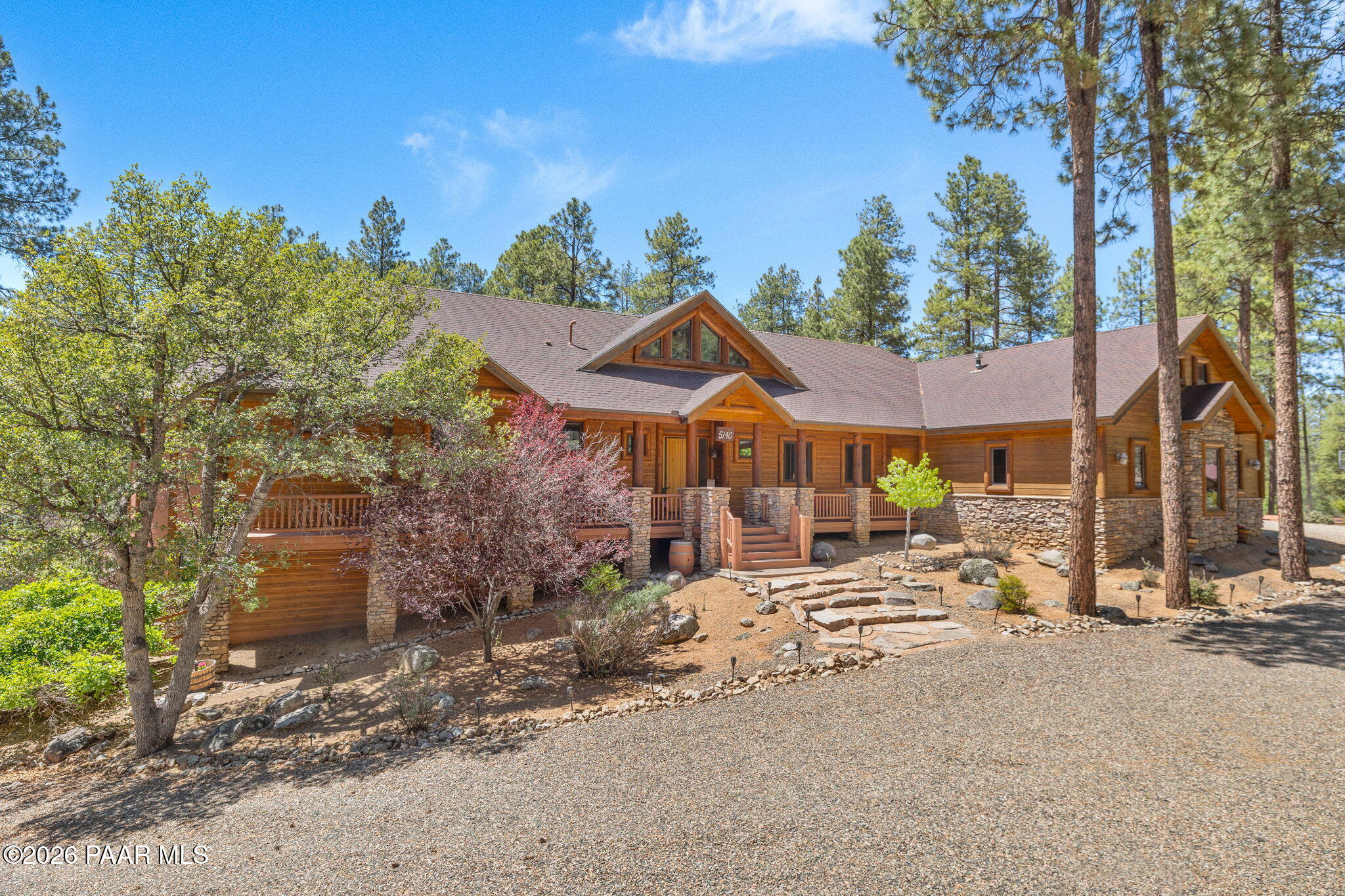 5140 East Charcoal Kiln Road Prescott, AZ 86303 - Photo 4 of 140 a front view of a house with a yard covered with green space