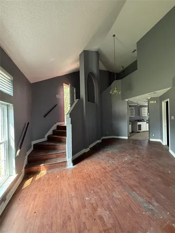 a view of a hallway with stairs