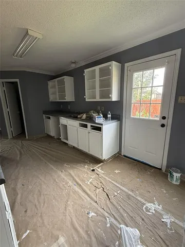 a kitchen with a stove a sink and a refrigerator