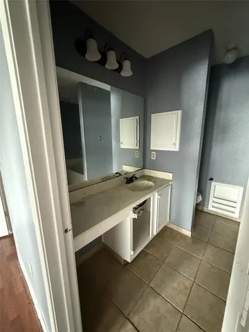 a kitchen with a stove and a refrigerator