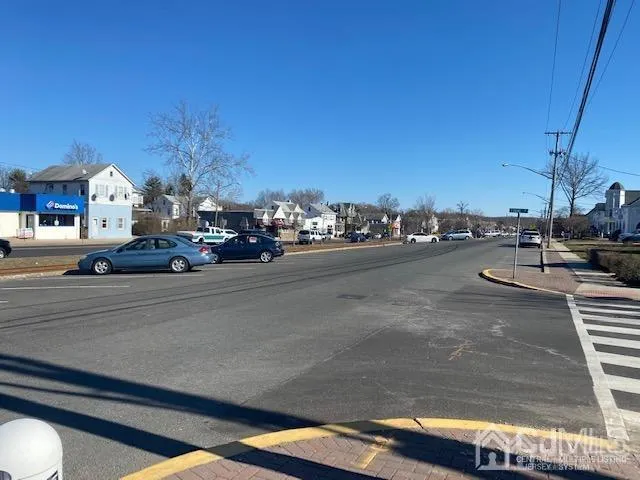 a view of a city street with cars