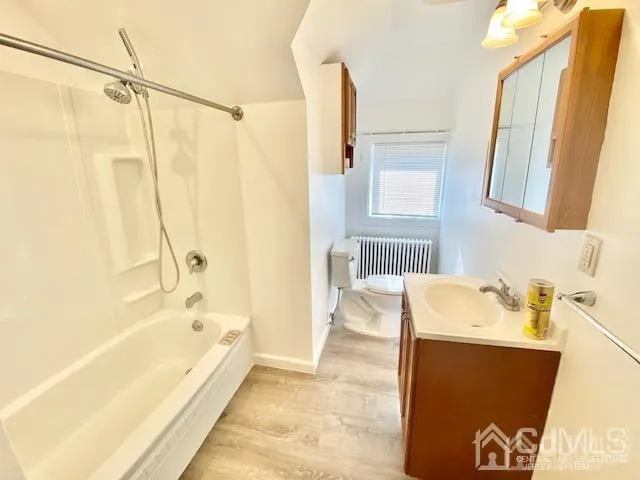 a bathroom with a bathtub and a sink