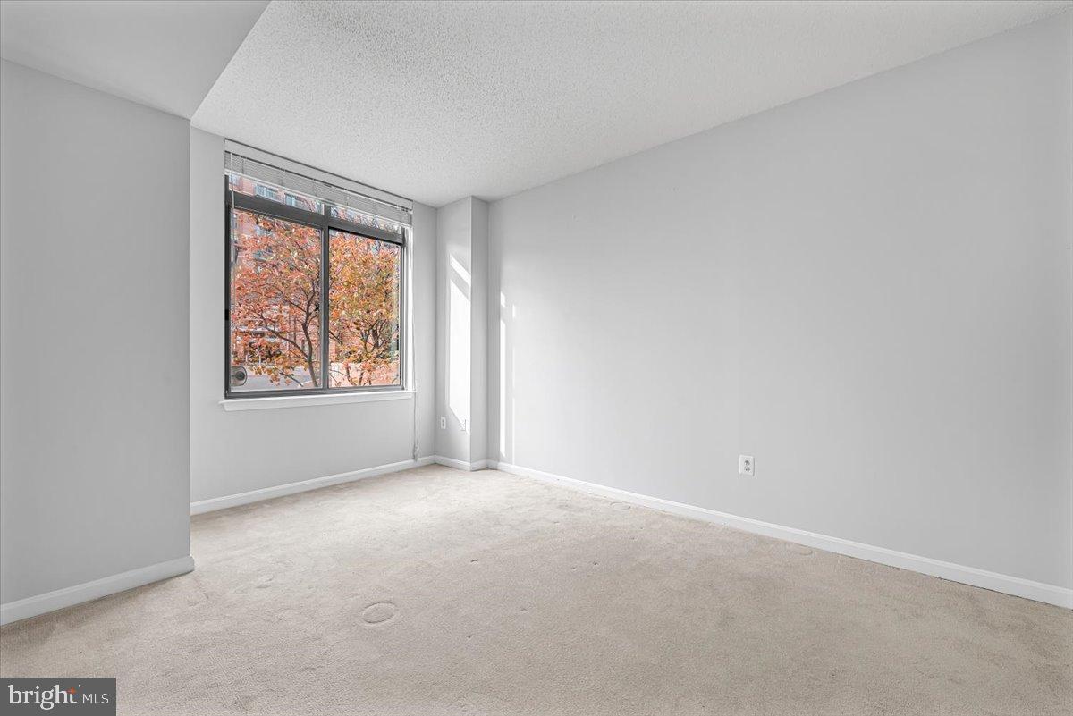 11710 Old Georgetown Road, Unit 121 North Bethesda, MD 20852 - Photo 11 of 35 an empty room with windows
