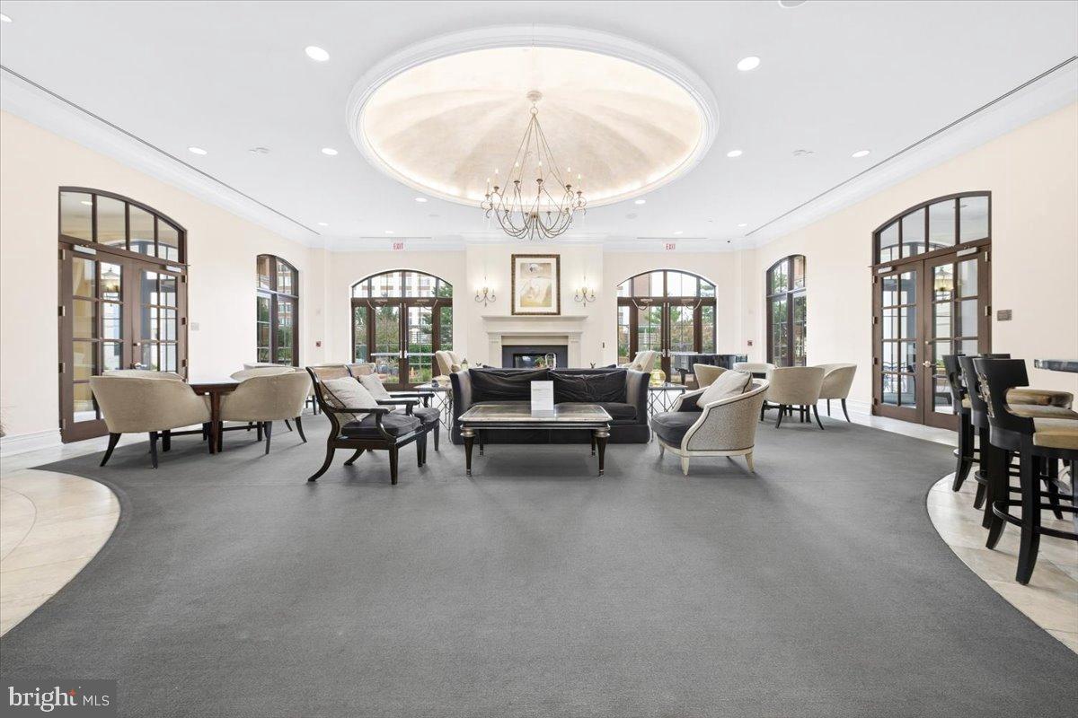 11710 Old Georgetown Road, Unit 121 North Bethesda, MD 20852 - Photo 21 of 35 a living room with furniture and a chandelier