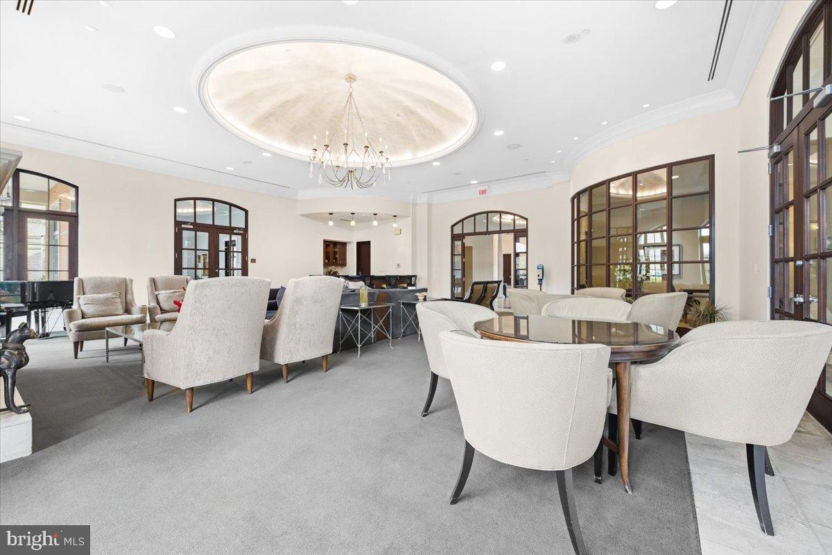 11710 Old Georgetown Road, Unit 121 North Bethesda, MD 20852 - Photo 22 of 35 a living room with furniture and a chandelier