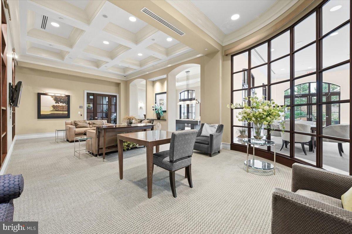 11710 Old Georgetown Road, Unit 121 North Bethesda, MD 20852 - Photo 23 of 35 a living room with furniture and a large window