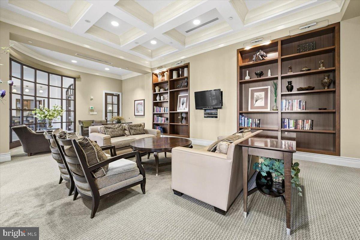 11710 Old Georgetown Road, Unit 121 North Bethesda, MD 20852 - Photo 24 of 35 a living room with furniture or couch and a bookshelf