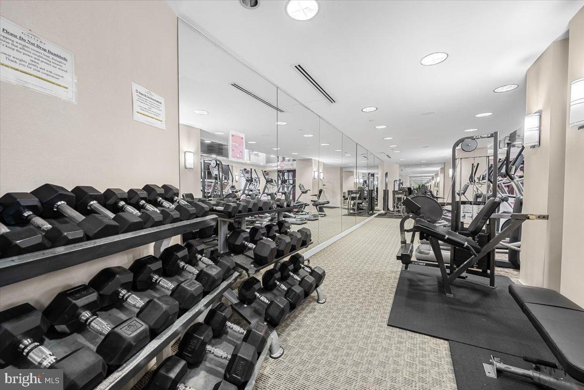 11710 Old Georgetown Road, Unit 121 North Bethesda, MD 20852 - Photo 28 of 35 a room with gym equipment and wooden floor