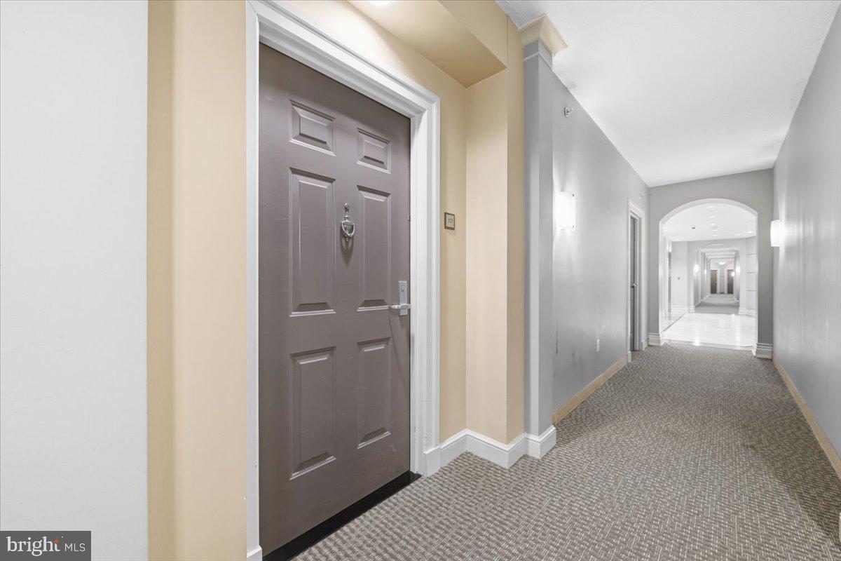 11710 Old Georgetown Road, Unit 121 North Bethesda, MD 20852 - Photo 7 of 35 a view of a hallway with wooden floor