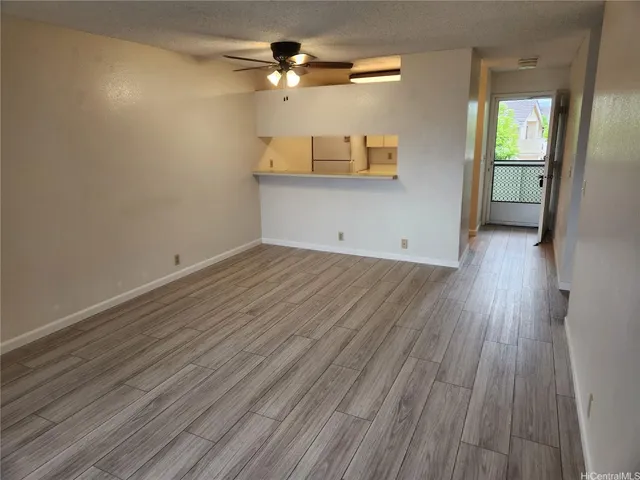 a view of a kitchen with wooden floor