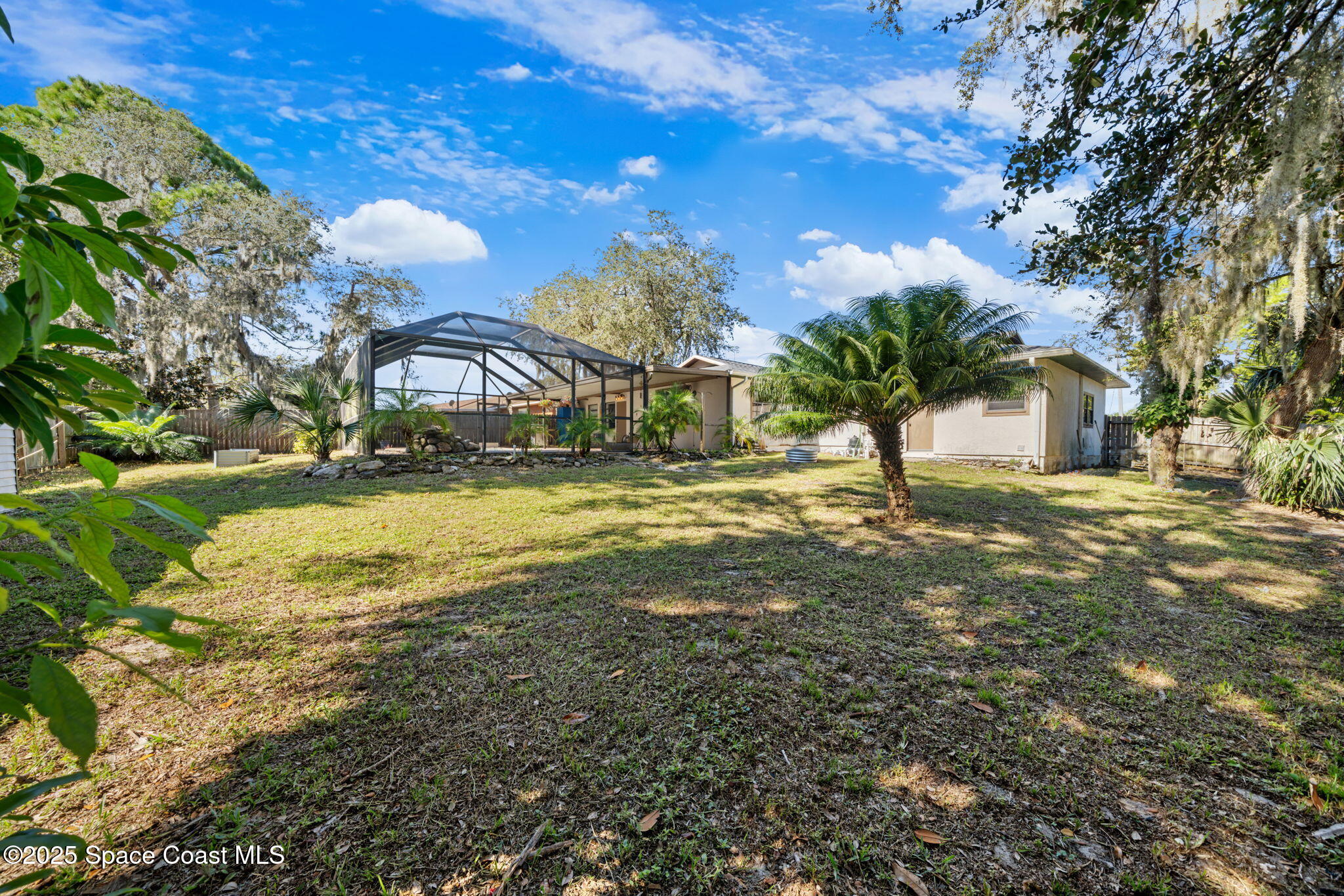 4257 Piedras Street Cocoa, FL 32927 - Photo 17 of 23 a view of a yard with a house