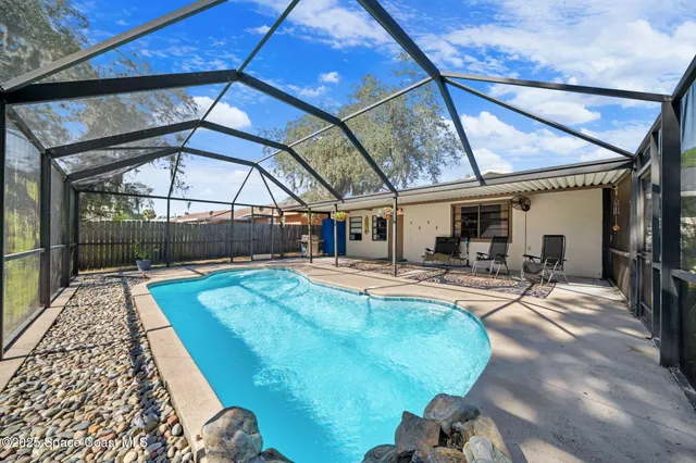 a view of a swimming pool with a patio