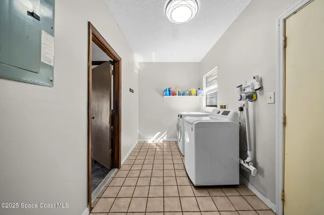 a room with water heater and a cabinet