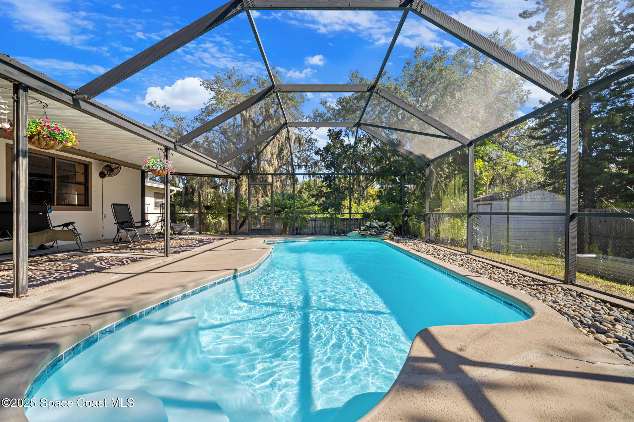 4257 Piedras Street Cocoa, FL 32927 - Photo 2 of 23 a view of a swimming pool with a patio