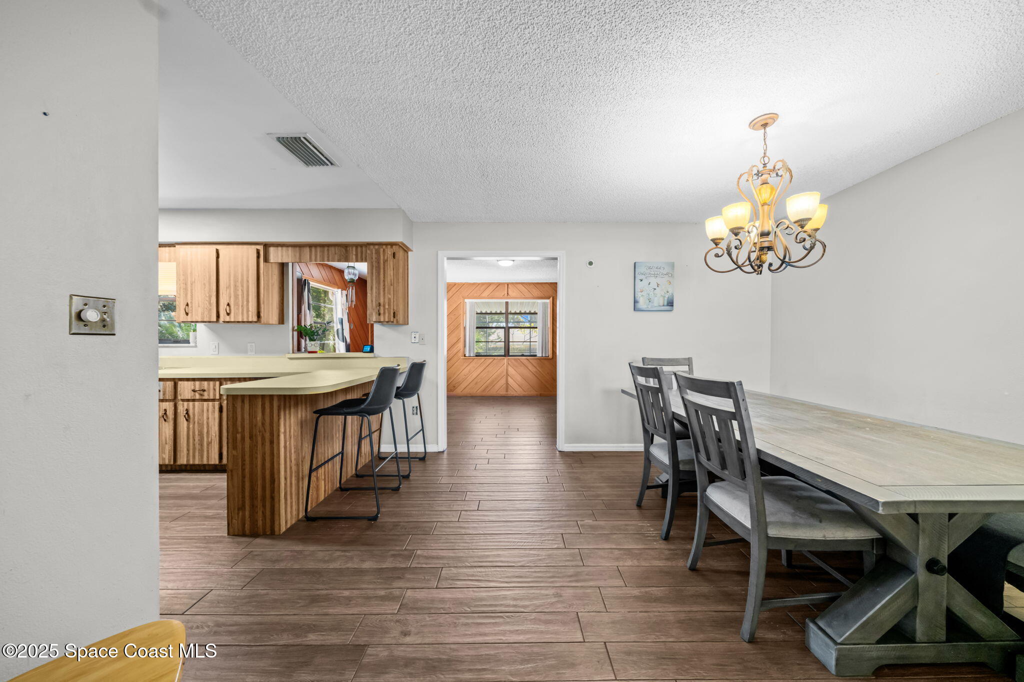 4257 Piedras Street Cocoa, FL 32927 - Photo 5 of 23 a view of a dining room with furniture and a chandelier