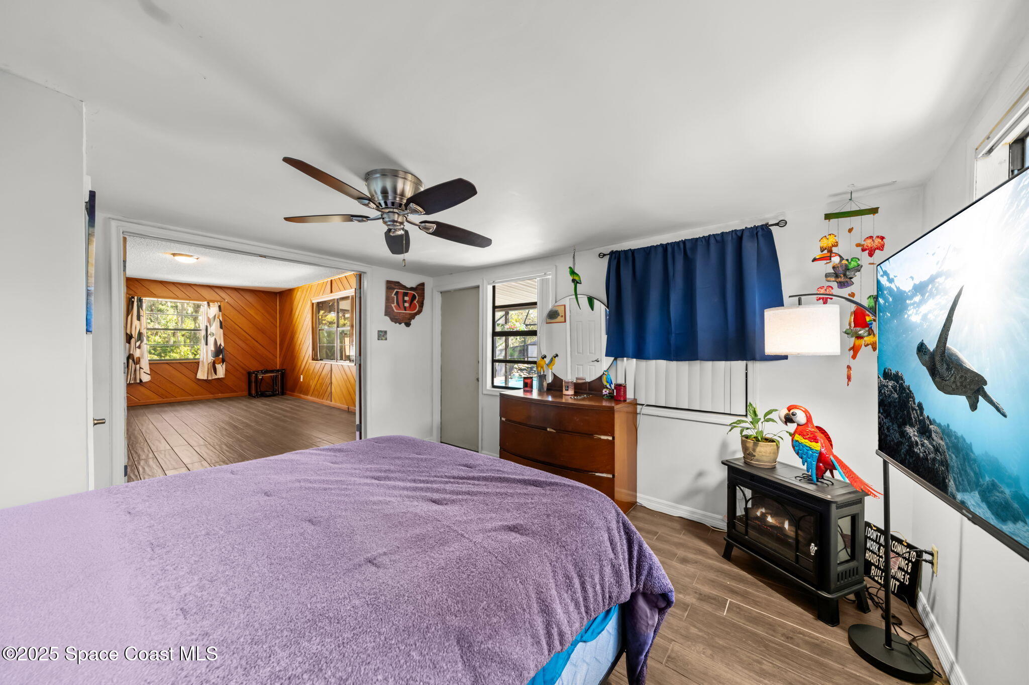 4257 Piedras Street Cocoa, FL 32927 - Photo 9 of 23 a bed room with a bed and a tv